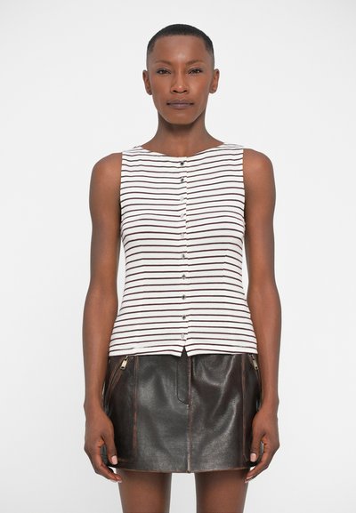 Striped sleeveless top in white and maroon, featuring front buttons; paired with a black leather skirt with zippered accents.