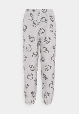 Pantalon de pyjama en polaire, gris avec motifs Hello Kitty noirs, taille élastique et jambes fuselées. Texture douce, design décontracté idéal pour la tenue de détente.
