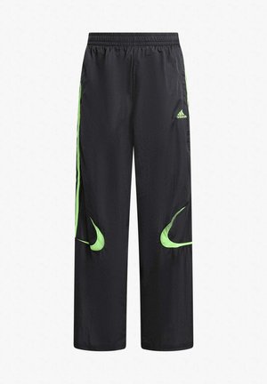 Schwarze Sporthose mit weitem Schnitt, versehen mit limettengrünen Akzenten, einem elastischen Bund und zwei Seitenstreifen. Hergestellt aus leichtem Material.