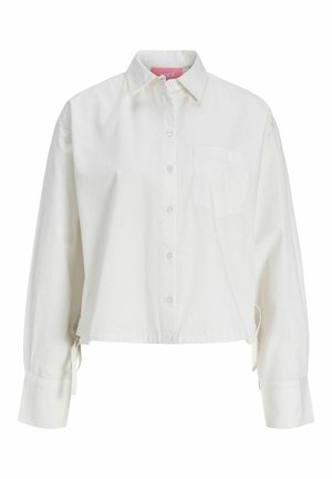 Chemise blanche à manches longues avec col, poche poitrine, ourlet court et liens latéraux réglables.