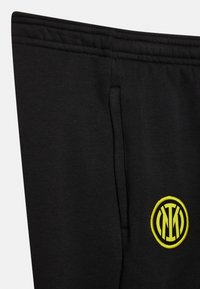 Nike Performance INTER MILAN PANT UNISEX - Pantalones deportivos - black/vibrant yellow