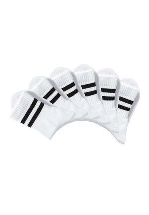 Six pairs of white ankle socks with two black stripes across the ribbed cuff, arranged in a fanned-out pattern on a white background.