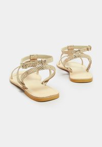 Long Tall Sally SNAKE STRAP - Sandaalit nilkkaremmillä - gold