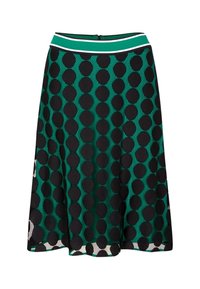 Falda verde en línea A con grandes lunares negros y una cinturilla verde con rayas blancas y negras.