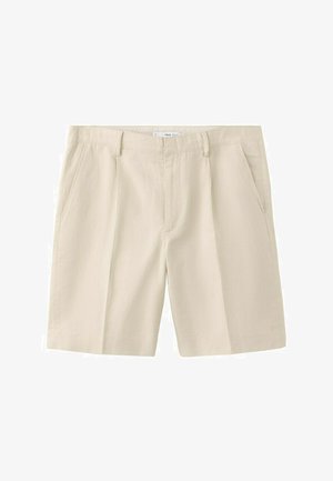 Bež bombažne kratke hlače do kolen z zankami za pas, stranskimi žepi in sprednjo zadrgo, položene na ravno belo ozadje.
