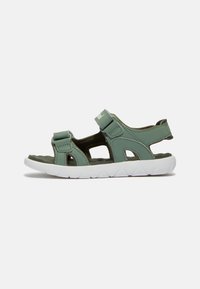 Groene synthetische sandalen met klittenbandsluitingen, open ontwerp en gestructureerde binnenzolen. Voorzien van een witte rubberen zool met een zigzagpatroon.