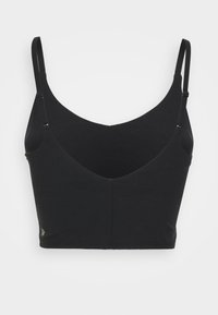 Top corto negro con escote en V profundo, tirantes ajustables y una tela suave y elástica. Presenta un pequeño detalle de logo en el dobladillo.