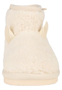 Helle beige Slipperboots aus plüschigem, strukturiertem Stoff, mit glatter Sohle und ohrähnlichen Akzenten an den Seiten, konzipiert für Komfort und Wärme.