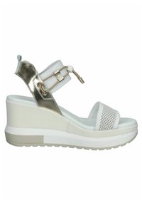 White wedge sandals with metallic gold accents, mesh detailing, adjustable ankle strap, and textured platform sole.