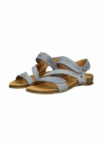 Šedé sandály mají několik křížících se pásků, korkovou stélku a plochou gumovou podrážku. Design obsahuje modré prošívání a minimalistický akcent.