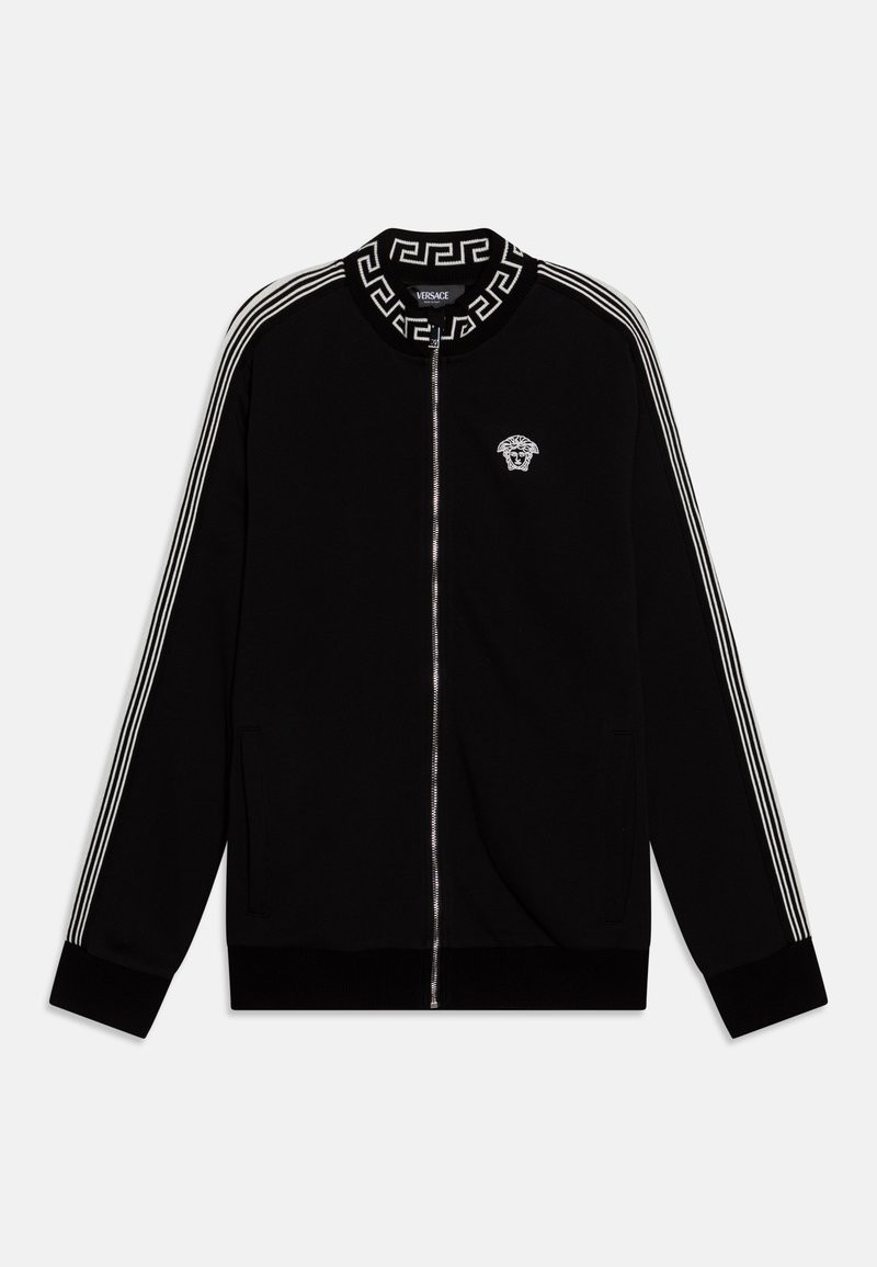 Black zip-up jacket made of soft fabric, featuring white stripes along sleeves, a Greek key pattern collar, and a small logo on the chest.