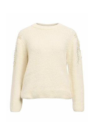 Cremefarvet sweater med en tekstureret, blød strik. Har lange ærmer og udsmykning på skuldrene med perler. Rundet udskæring.