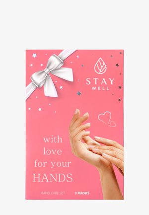 Boîte de coffret soins des mains rose avec un ruban blanc, des étoiles et des cœurs illustrés, deux mains se touchant, et le texte « Prenez soin de vous avec amour pour vos mains. »