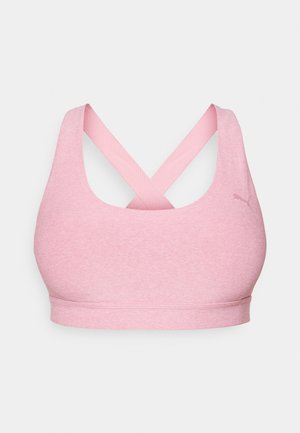 Lys rosa trenings-BH med scoop-hals og kryssede stropper bak. Laget av et glatt, elastisk stoff. Minimal merkevare på siden.