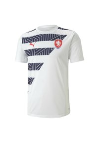 Bílá sportovní košile s námořnickými zigzag vzory a červeným znakem. Má kulatý výstřih a krátké rukávy. Vyrobena z prodyšného materiálu.