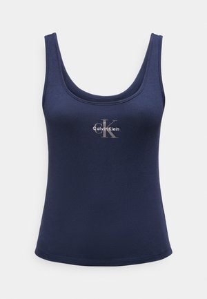 Γυναικείο φανελάκι σε ναυτικό μπλε με λαιμόκοψη scoop και λευκό-γκρι λογότυπο Calvin Klein στο κέντρο του στήθους.