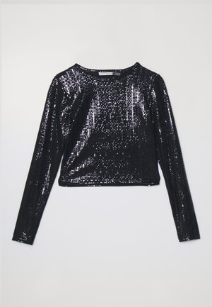 Black cropped long-sleeve top covered in sequins, featuring a round neckline and a smooth texture. Light reflects off the shiny surface.