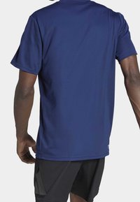 Navy blue athletic t-shirt with a streamlined design and short sleeves, made of breathable fabric, featuring a textured surface and a slight stretch.