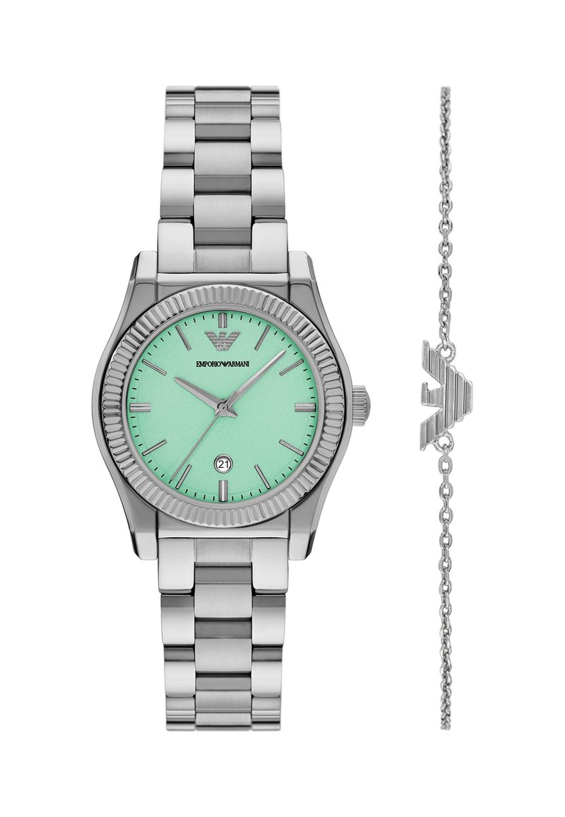 Silberner Edelstahlarmbanduhr mit mintgrünem Zifferblatt, geriffelter Lünette und Datumsfenster. Inkludiert ein silbernes Gliederarmband mit einem Logo-Anhänger.