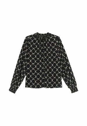 Svart blus med ett vitt geometriskt mönster, hög hals, långa ärmar och elastiska cuffs. Mjuk tyg med en något strukturerad yta.