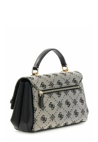 Sac en tissu beige texturé avec un motif monogramme noir, accents en cuir noir, poignée supérieure et poche zippée avec ferrures dorées.