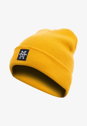 Yellow knitted beanie with a ribbed texture, featuring a folded cuff and a navy blue patch displaying white lettering.