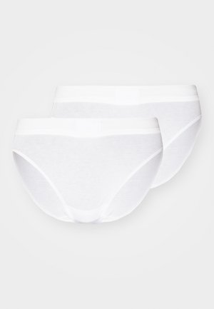 White cotton panties, featuring a smooth finish and elastic waistband with tags. Two pieces displayed with seamless edges and moderate coverage.