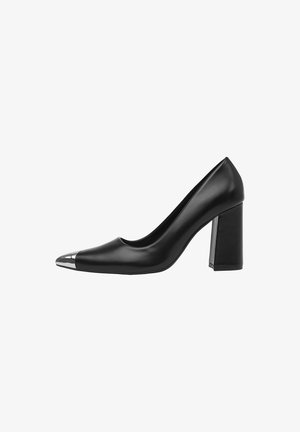 Black leather high-heeled shoe with a block heel and metallic silver cap on the pointed toe.