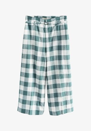 Pantalon large à carreaux verts et blancs avec taille haute et ceinture assortie en tissu avec boucle argentée.