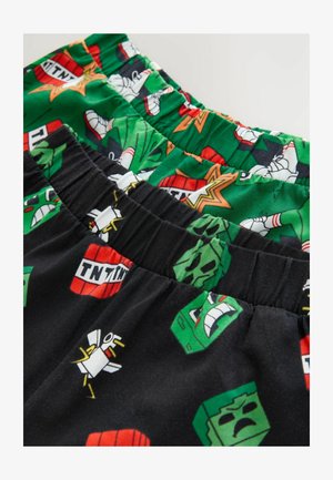 Boxeri colorați expuși în straturi: negri cu personaje de desene animate, verzi cu diverse modele și accente roșii. Material moale cu benzi elastice la talie.