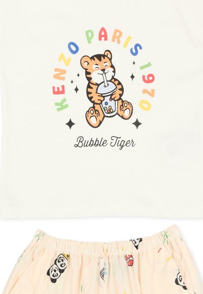 Kreskówkowy tygrys pijący bubble tea, otoczony kolorowym napisem "Kenzo Paris 1969" u góry oraz "Bubble Tiger" u dołu na białej tkaninie.