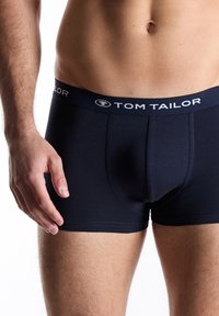 Navy cotton boxer shorts with a fitted design, featuring a branded elastic waistband with "TOM TAILOR" in white lettering.