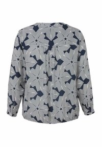 Langärmlige Bluse in Marineblau und Weiß mit geometrischem Muster; zeichnet sich durch einen lockeren Schnitt und einen runden Halsausschnitt mit einem Rückenschlitz für zusätzliches Design aus.