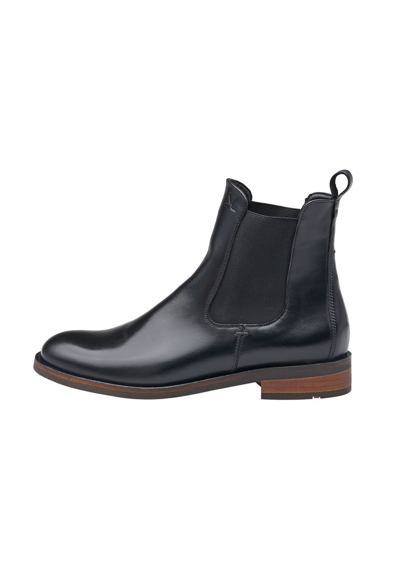 Botte Chelsea en cuir noir avec panneaux élastiques sur les côtés et tirette, dotée d'un bout arrondi et d'une semelle en bois. Fini lisse et élégant.