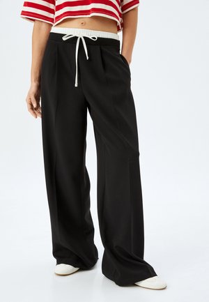 BAGGY - Broek - black