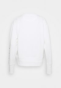 Sweatshirt blanc avec manches longues, col rond et coupe courte avec ourlet côtelé. Dos uni sans logo ni motif visible.