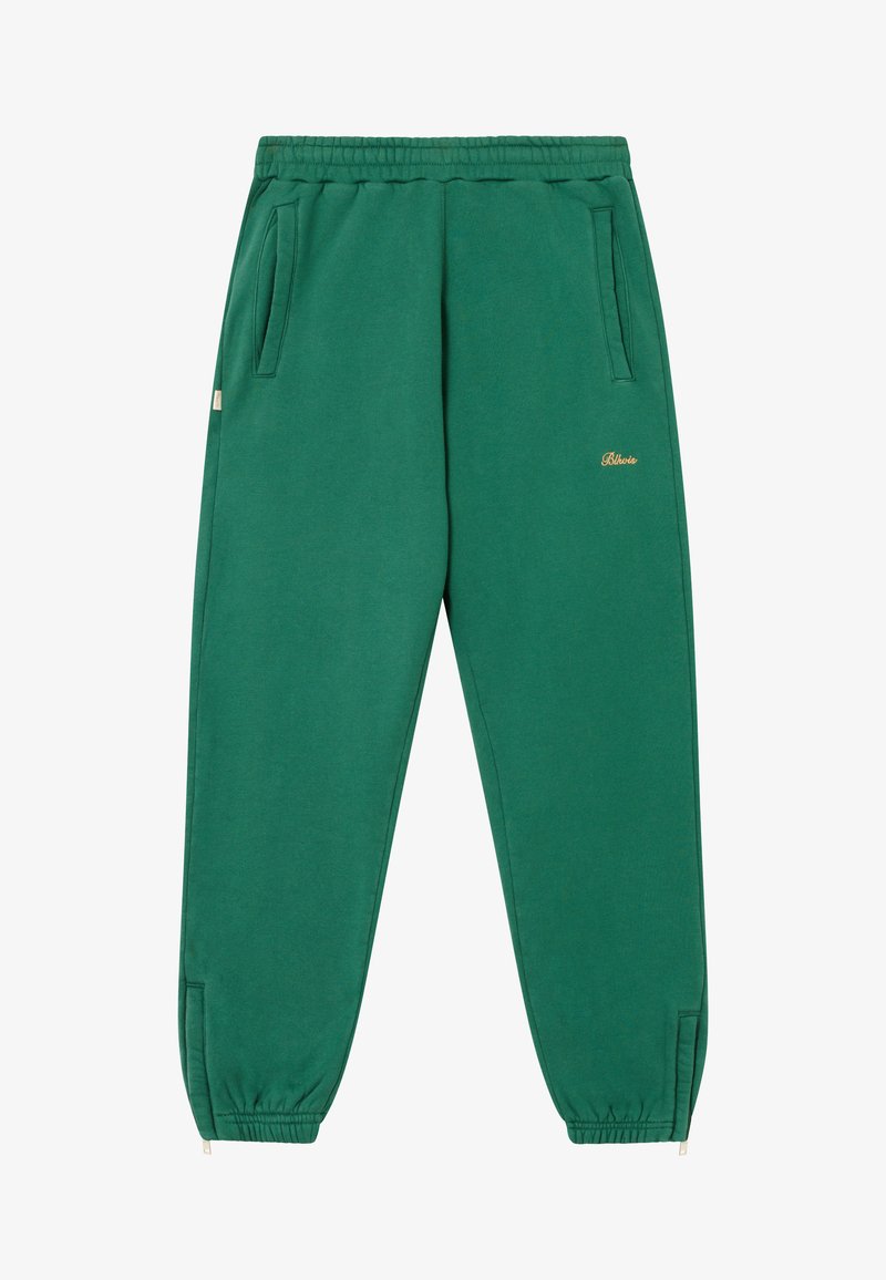 Green cotton joggers with elastic waistband, side pockets, and gold logo detail; tapered ankles with elastic cuffs.