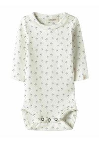 Hvit langermet body med små grå blomsterprint. Den har rund hals og knapper i bunnen for enkel påkledning. Mykt stoff.