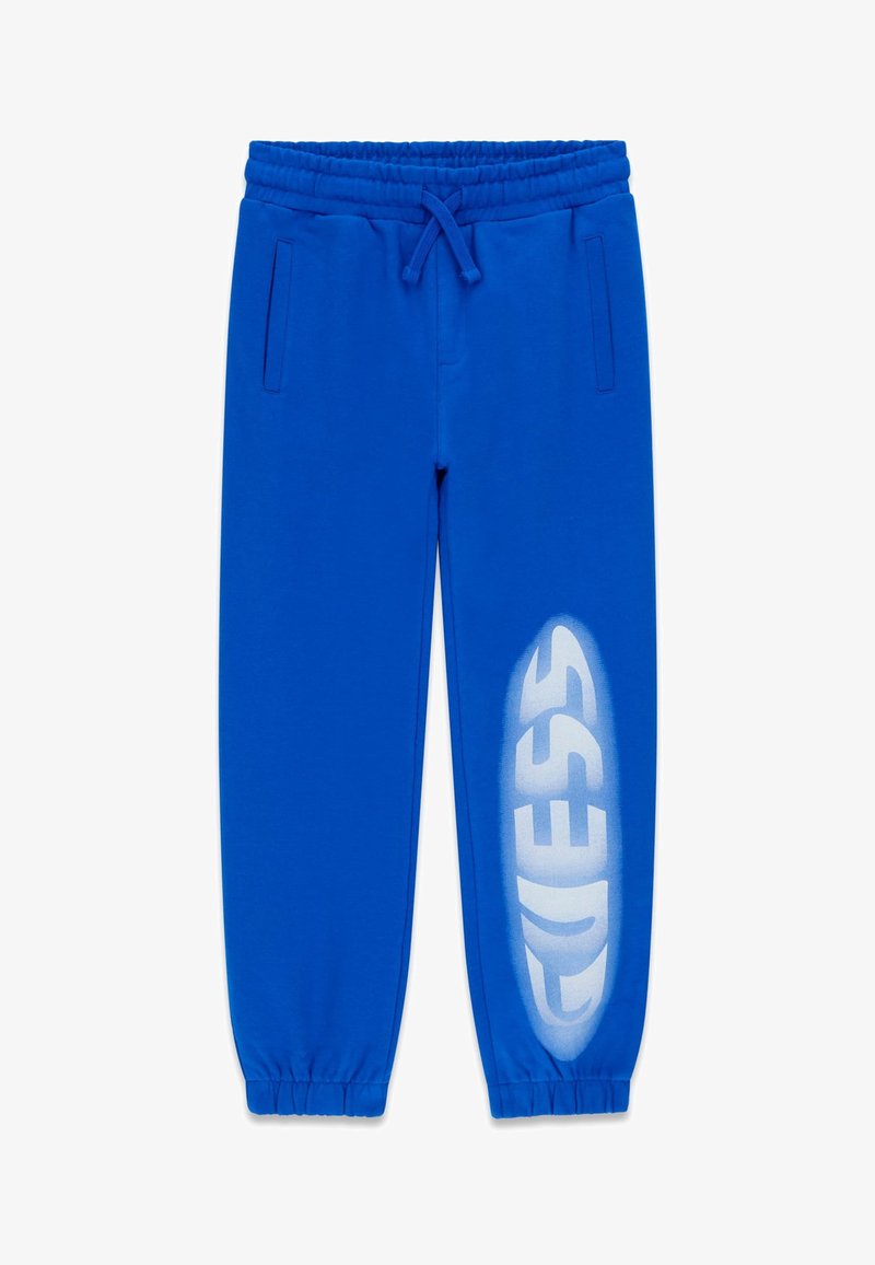 Blaue Jogginghose aus weichem Material, mit einem elastischen Bund, zwei Seitentaschen und einem großen weißen Logo am linken Bein.
