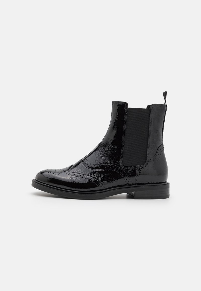 Black patent leather Chelsea boots with elastic side panels, brogue detailing, rounded toe, and a low block heel.