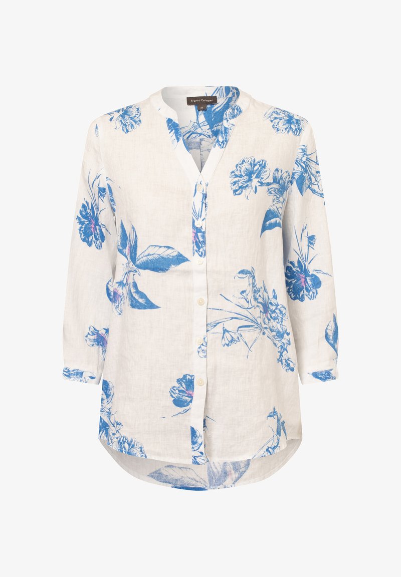 White linen shirt with blue floral pattern, button front, and a relaxed fit. Features a round neckline and three-quarter sleeves.