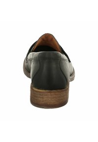 Schwarze Lederschuhe mit abgerundeter Zehe, genähten Details und einem mittelgroßen, holzfarbenen Absatz. Das Innere ist mit braunem Leder gefüttert für Komfort.