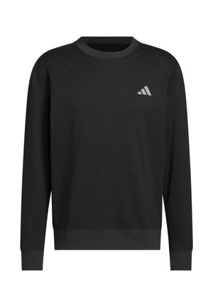 Sweatshirt noir en matière douce, avec un col rond, des manches longues, et un petit logo triangulaire gris sur le côté gauche de la poitrine.