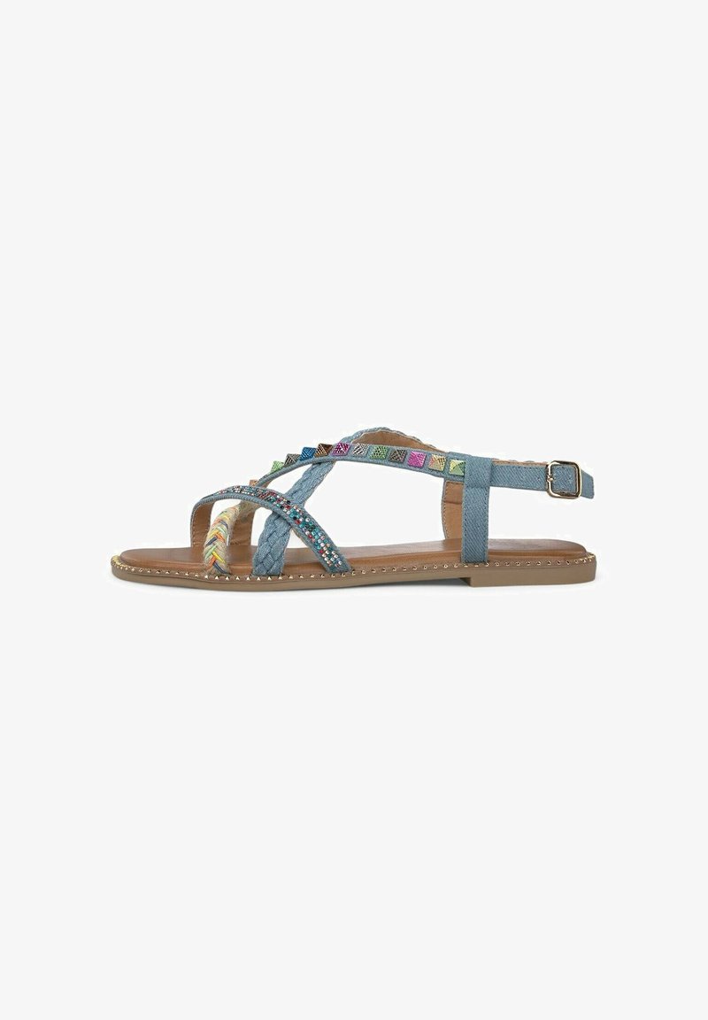 Blue denim sandals with braided straps and colorful decorative accents. Flat sole with a metallic studded trim, adjustable ankle strap.