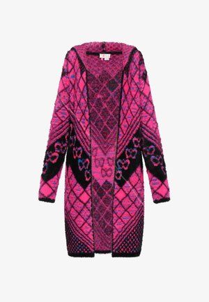 Fuzzy long cardigan featuring bold, geometric pink and black patterns, open front, and textured sleeves. Made from soft, warm material.