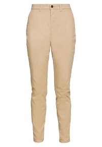 Beige chinos met een slim fit, voorzien van een knoopsluiting, riemlussen en zakken. Gemaakt van zachte stof met subtiele stikseldetails.