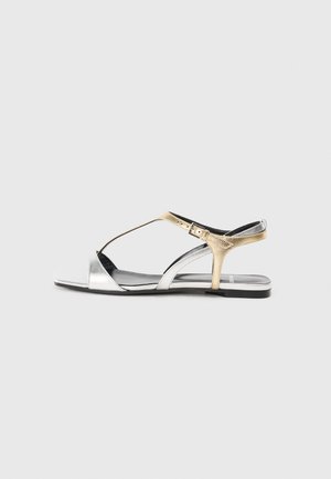 RIO - T veida siksniņu sandales - metal silver-coloured/champagne