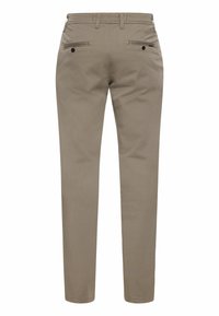 Beige Chino-Hosen mit schmaler Passform aus Baumwolle. Verfügt über zwei Gesäßtaschen mit Knöpfen und einen Reißverschluss. Glatte Textur, keine Muster.