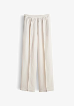 Beige wide-leg pants with elastic waistband and no visible pockets, displayed against a white background.