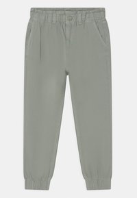 Light gray pants with a drawstring elastic waistband, two side pockets, tapered legs, and elastic cuffs. Made from a textured fabric.